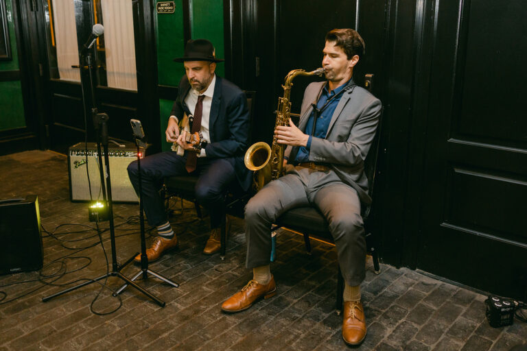 Live musicians performing ceremony music at a New Orleans wedding